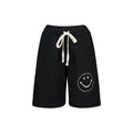 SHORTS CON SILUETA DE CARA SONRIENTE